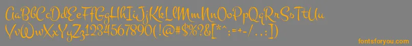 MontezRegular-Schriftart – Orangefarbene Schriften auf grauem Hintergrund