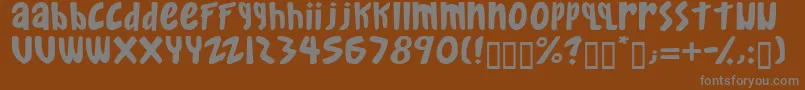 Gkreib-fontti – harmaat kirjasimet ruskealla taustalla