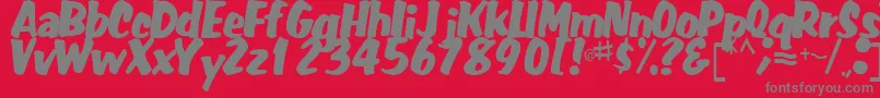 FatRegularTtstd-fontti – harmaat kirjasimet punaisella taustalla