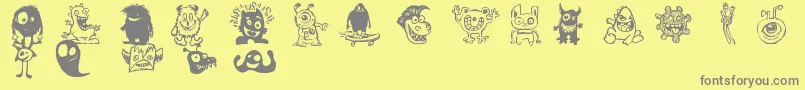 フォントHappyMonsters – 黄色の背景に灰色の文字