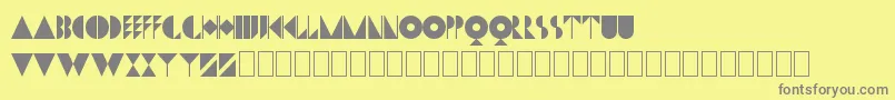 DwigginsInitialsKk Font – Gray Fonts on Yellow Background