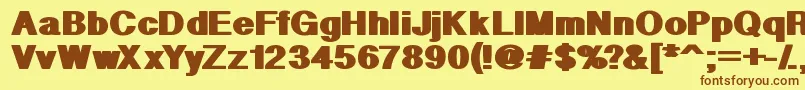 フォントGeometric – 茶色の文字が黄色の背景にあります。