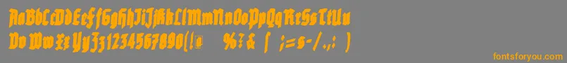 フォントRottenscript – オレンジの文字は灰色の背景にあります。