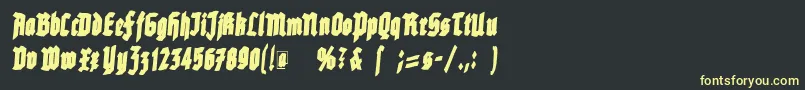 フォントRottenscript – 黒い背景に黄色の文字