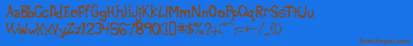 フォントBetad – 茶色の文字が青い背景にあります。