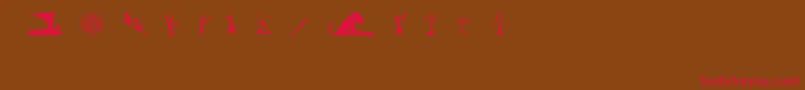 フォントGutoLacazPw – 赤い文字が茶色の背景にあります。