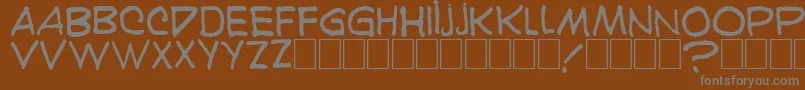 Karaoglan-fontti – harmaat kirjasimet ruskealla taustalla