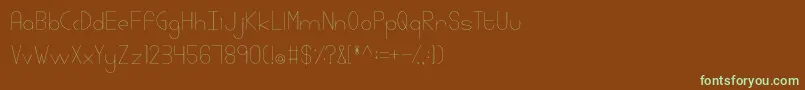 フォントLinlegreyregular – 緑色の文字が茶色の背景にあります。