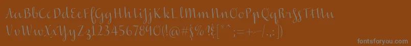 フォントInscreamingcolor – 茶色の背景に灰色の文字