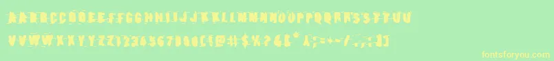 フォントEarthshakebold – 黄色の文字が緑の背景にあります