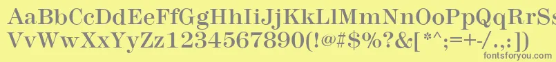 MontpellierRegular-fontti – harmaat kirjasimet keltaisella taustalla