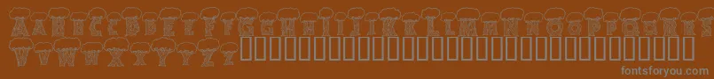 フォントAlphatrees – 茶色の背景に灰色の文字