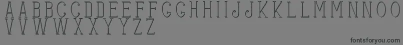 フォントStitchesshadow – 黒い文字の灰色の背景