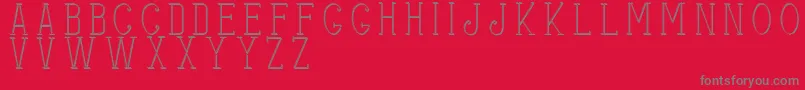 Stitchesshadow-fontti – harmaat kirjasimet punaisella taustalla