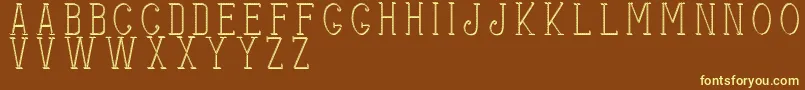 Stitchesshadow-fontti – keltaiset fontit ruskealla taustalla