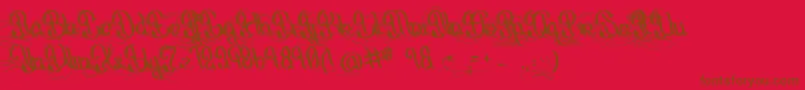 フォントOrigineDuMonde – 赤い背景に茶色の文字