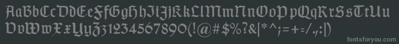 フォントTypographergotischaunz1 – 黒い背景に灰色の文字