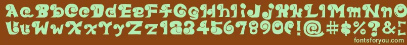 フォントEyefont – 緑色の文字が茶色の背景にあります。