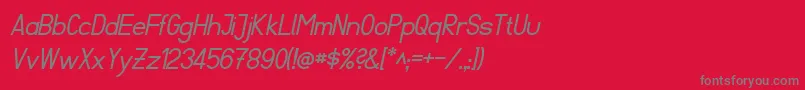FibelSuedItalic-Schriftart – Graue Schriften auf rotem Hintergrund