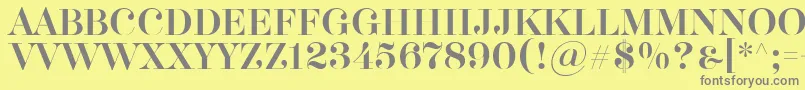 Akerbryggedisplay-fontti – harmaat kirjasimet keltaisella taustalla