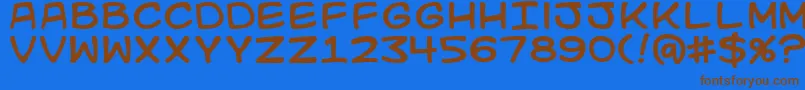 Kidkosmic Font – Brown Fonts on Blue Background