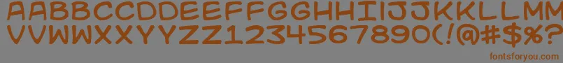 Kidkosmic Font – Brown Fonts on Gray Background