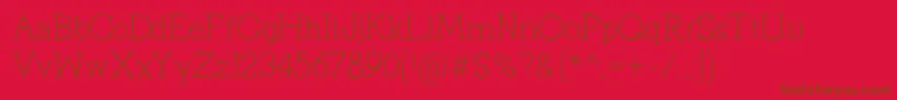 PrimitivaLight-Schriftart – Braune Schriften auf rotem Hintergrund