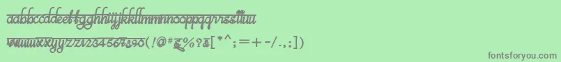 Fonte BitsindiancalligraBold – fontes cinzas em um fundo verde