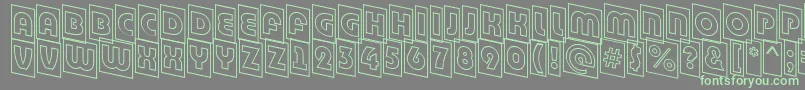 フォントABighaustitulcmdnotl – 灰色の背景に緑のフォント