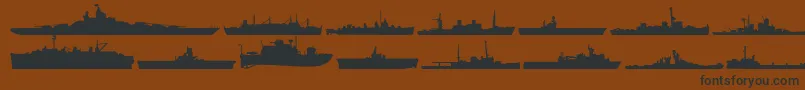 Usnavy-Schriftart – Schwarze Schriften auf braunem Hintergrund