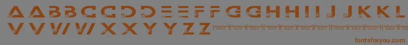 Więcej informacji o czcionce Outerspacemilitia Czcionka Outerspacemilitia – brązowe czcionki na szarym tle