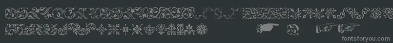 Baroqueornaments-fontti – harmaat kirjasimet mustalla taustalla