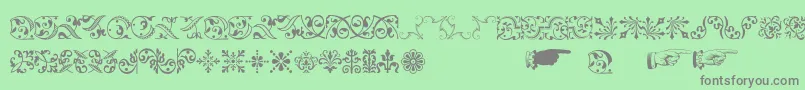 Baroqueornaments-Schriftart – Graue Schriften auf grünem Hintergrund