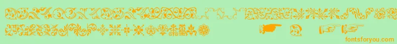 フォントBaroqueornaments – オレンジの文字が緑の背景にあります。