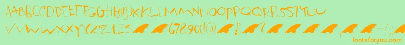 フォントDkRavenheart – オレンジの文字が緑の背景にあります。