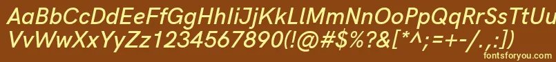 HkgroteskSemibolditalic-fontti – keltaiset fontit ruskealla taustalla