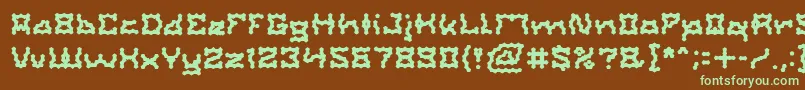 フォントShakeItOff – 緑色の文字が茶色の背景にあります。