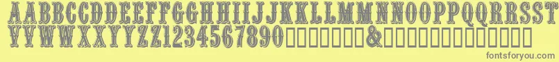 Fonte Quencrg – fontes cinzas em um fundo amarelo