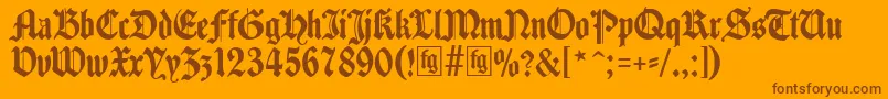 Traditio-fontti – ruskeat fontit oranssilla taustalla