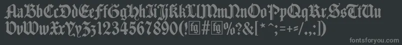 Traditio-fontti – harmaat kirjasimet mustalla taustalla