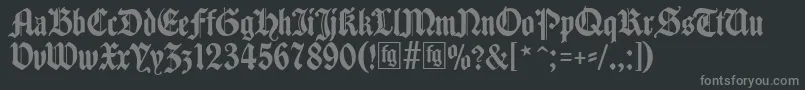 フォントTraditio – 黒い背景に灰色の文字