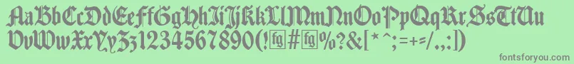 Traditio-fontti – harmaat kirjasimet vihreällä taustalla