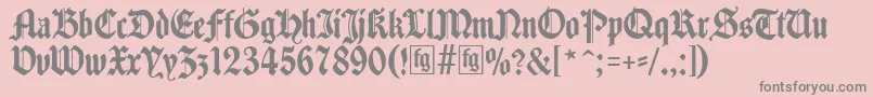 フォントTraditio – ピンクの背景に灰色の文字