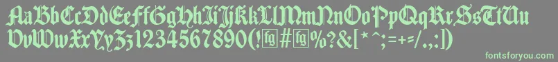 フォントTraditio – 灰色の背景に緑のフォント