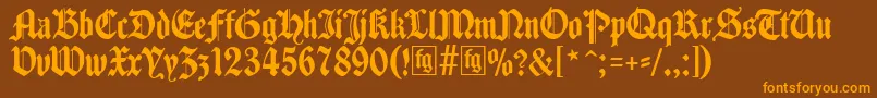 Traditio-fontti – oranssit fontit ruskealla taustalla