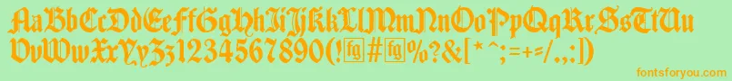 Traditio-fontti – oranssit fontit vihreällä taustalla