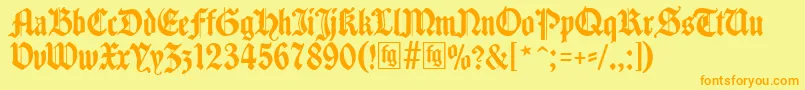 フォントTraditio – オレンジの文字が黄色の背景にあります。