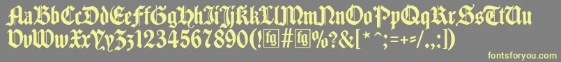 Traditio Font – Yellow Fonts on Gray Background