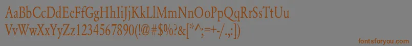 フォントYearlindNormalCondensed – 茶色の文字が灰色の背景にあります。