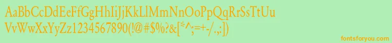 フォントYearlindNormalCondensed – オレンジの文字が緑の背景にあります。